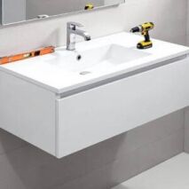 Step-by-step wall hung vanity installation in a modern bathroom, showing fixing brackets, a level tool, and a power drill for a secure and stylish setup.