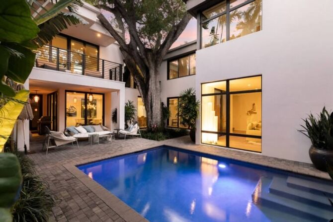 Modern home with large windows maximising natural light and style