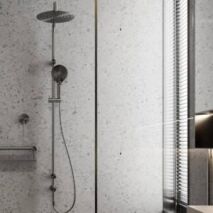 Integrated dual shower system with overhead rainfall shower and handheld shower on a single rail.