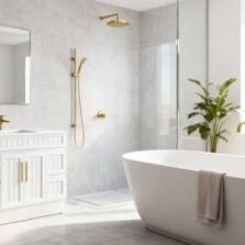 Modern bathroom with brushed gold basin mixer, shower tapware and bath tap in matching finish