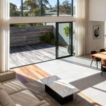 Tile and timber flooring comparison in a modern Australian home interior, showcasing popular flooring options for Perth homes.