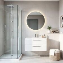 Modern small bathroom design idea with walk-in shower, floating vanity, and round LED mirror, showcasing a bright, minimalist space-saving design ideal for Perth homes