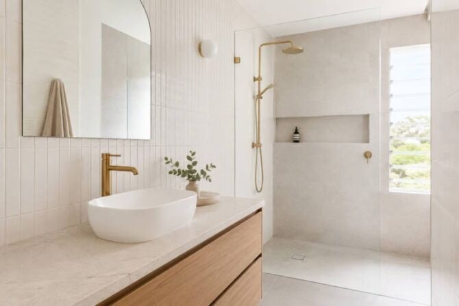 Brushed gold bathroom tapware styled with warm tiles in a Perth bathroom
