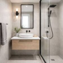 Small bathroom with floating vanity and wall-mounted towel rail showing space-saving bathroom accessories