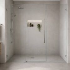 Wall-to-wall frameless shower screen spanning a tiled bathroom alcove in Perth