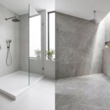 A side-by-side comparison of a modern white shower base and a seamless tiled shower floor in a Perth bathroom renovation