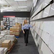 Customer browsing wall tile displays at Ross’s Discount Home Centre showroom in Perth, featuring a wide range of quality tiles for bathrooms, kitchens, and floors