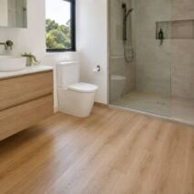 Hybrid flooring in the dry area of a Perth bathroom with a separate tiled shower