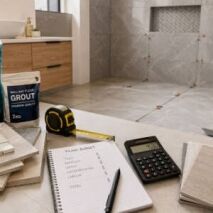 Bathroom renovation with tile samples, adhesive, grout, calculator and tiling budget plan for Perth tiling costs