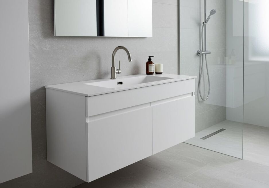 Modern bathroom with wall-hung vanity and integrated sink from Ross’s Discount Home Centre, showcasing a sleek and functional sink and cabinet combo