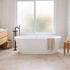Freestanding bath in a modern Australian bathroom showing typical bathtub size and layout