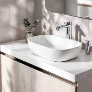 Modern white above-counter bathroom sink with chrome tapware on light timber vanity in bright Perth bathroom
