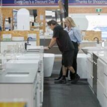 Customer browsing bathroom supplies in Ross’s Discount Home Centre Perth showroom – trusted local bathroom supplies Perth
