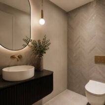 Stylish small powder room in a Perth home with space-saving fixtures