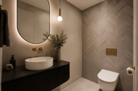Stylish small powder room in a Perth home with space-saving fixtures