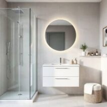 Modern small bathroom design idea with walk-in shower, floating vanity, and round LED mirror, showcasing a bright, minimalist space-saving design ideal for Perth homes