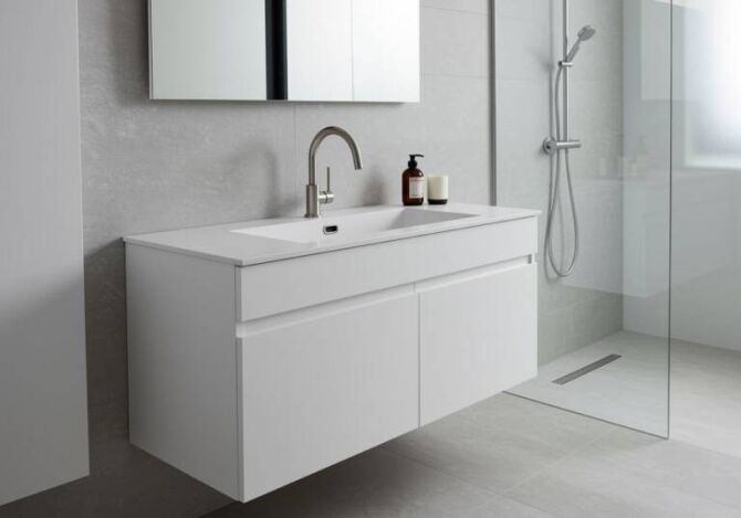 Modern bathroom with wall-hung vanity and integrated sink from Ross’s Discount Home Centre, showcasing a sleek and functional sink and cabinet combo